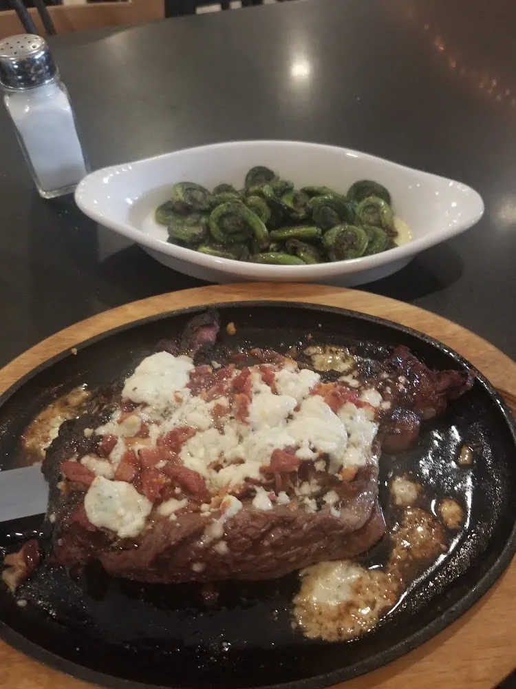 Bacon and Blue Delmonico Steak with Fiddle Heads